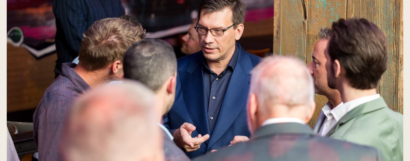 Owners in close conversation with Jim at a session